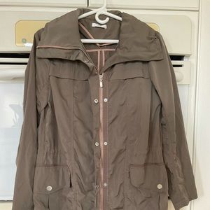 Light weight rain coat with hood, size medium, light brown, used.